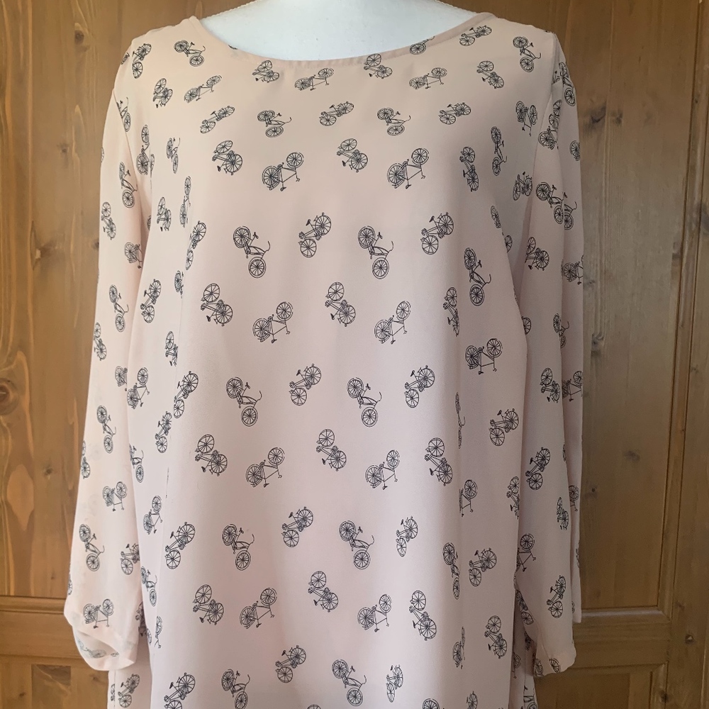 Blush top with mini bicycles